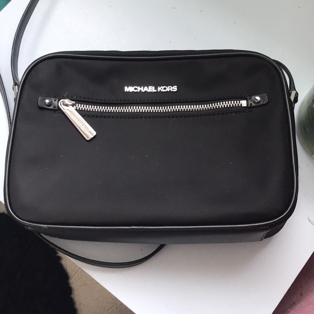 Michael Kors black adjustable strap purse tags on